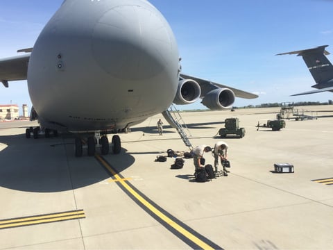 Crews work to maintain a C-5 cargo plane at Travis Air Force Base. There are 58 planes of different types that call Travis home.