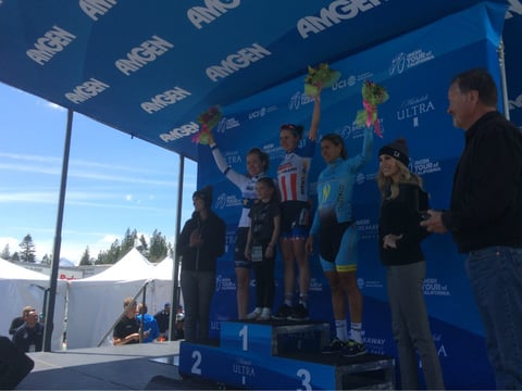Anna van der Breggen, Megan Guarnier, and Arlenis Sierra wave to the crowd from the podium after stage 1 of the 2017 Amgen Women's Race at South Lake Tahoe.