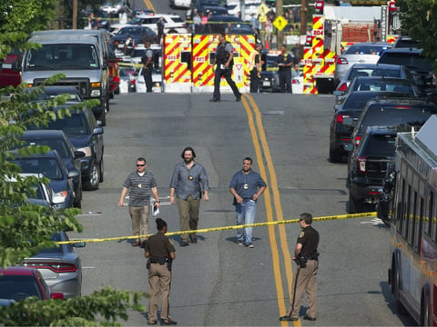 Police and emergency personnel are seen near the scene where House Majority Whip Steve Scalise of La. was shot during a Congressional baseball practice in Alexandria, Va., Wednesday, June 14, 2017. 