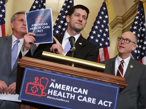 Speaker of the House Paul Ryan holds up a copy of the American Health Care Act during a March 7 news conference with House Majority Leader Kevin McCarthy, R-Calif. (left), and House Energy and Commerce Committee Chairman Greg Walden, R-Ore.