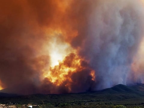 Flames and smoke rise from a fire near Mayer, Ariz. By Thursday, the Goodwin Fire had burned more than 20,000 acres and was just 1 percent contained.