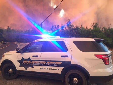 Photograph of a Butte County Sheriff's Office vehicle taken on July 9, 2017. The Wall Fire can be seen in the background. The blaze, which started on July 7, has destroyed 41 residences and burned more than 6,000 acres.