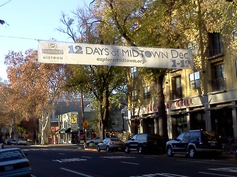 The "12 Days of Midtown" Banner stretched across L Street.