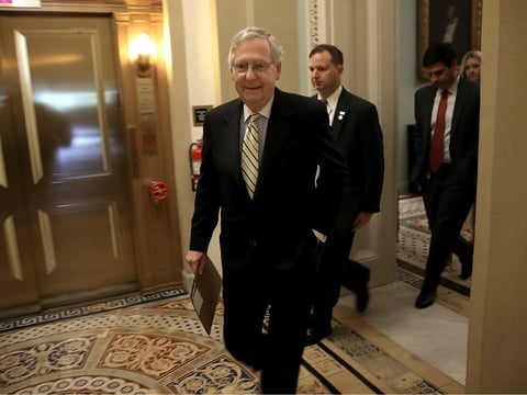 Senate Majority Leader Mitch McConnell, R-Ky., walks to a meeting in the U.S. Capitol on Tuesday. The U.S. Senate is scheduled to hold a key procedural vote health care.