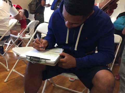 Grant Union High School senior James Fotofini fills out a voter registration form on National Voter Registration Day, Tuesday, September 26, 2017.