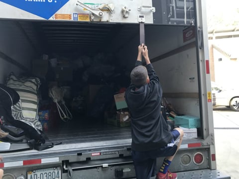 The DeJong family loads a U-Haul truck full of supplies headed to wildfire victims in Rohnert Park.