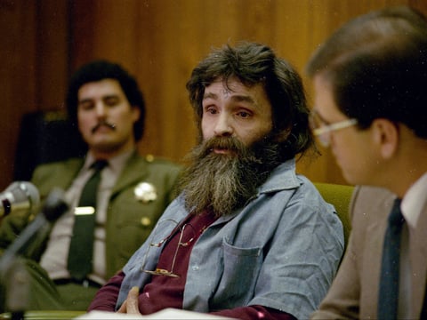 Charles Manson (center), seen during a parole hearing in California in 1986.