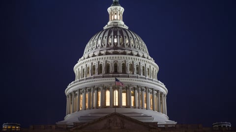 The U.S. Capitol pictured Thursday night in Washington, as Senate Republicans work toward passing a stripped-down version of health care, which would eliminate the individual mandate.