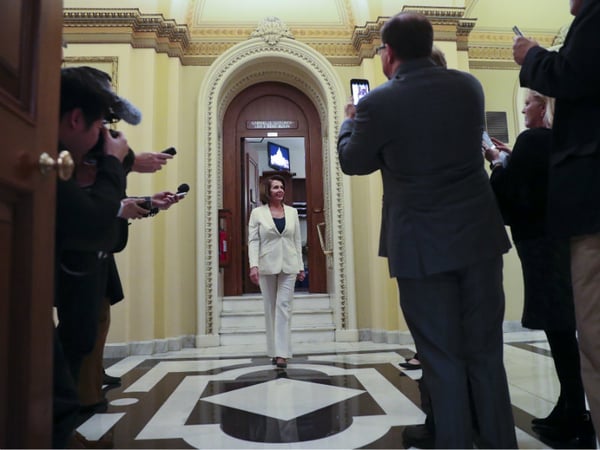 House Minority Leader Nancy Pelosi of Calif., leaves the House chamber after staging a marathon, daylong filibuster, on Capitol Hill in Washington. Wednesday, Feb. 7, 2018. 