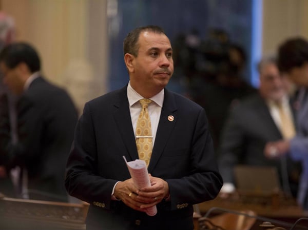 Democratic State Sen. Tony Mendoza stands on the floor of the Senate chambers in between private meetings of the Democratic caucus, Wednesday, Jan. 3, 2018, in Sacramento, Calif. 