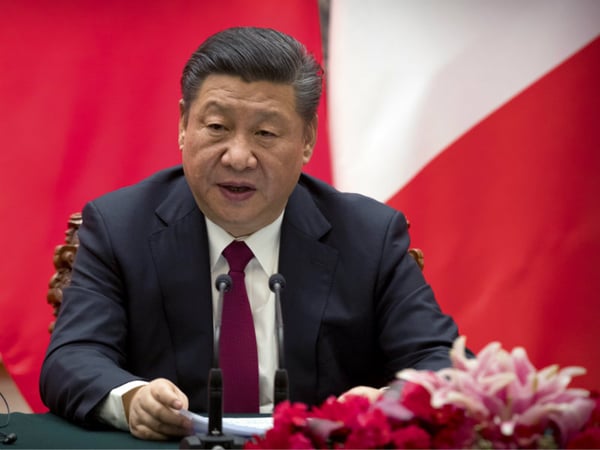 Chinese President Xi Jinping speaks during a joint press briefing with French President Emmanuel Macron, at the Great Hall of the People in Beijing, Tuesday, Jan. 9, 2018.