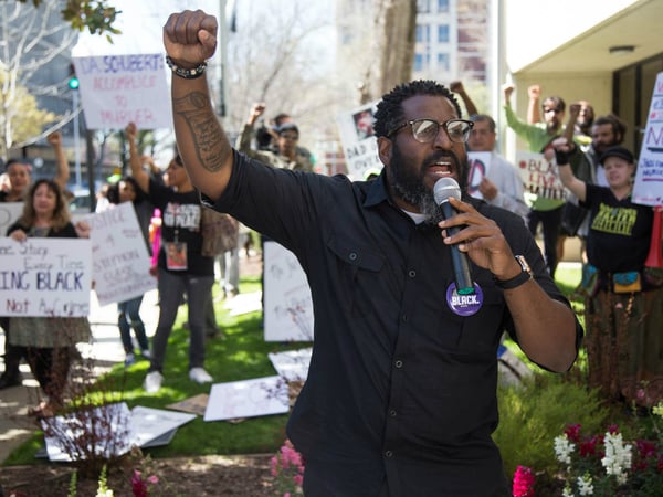 Protesters rally in front of the Sacramento County District Attorney's Office March 27, 2018.