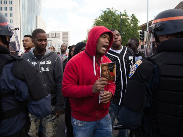 Demonstrators engage with police officers at a protest in downtown Sacramento over the death of Stephon Clark.