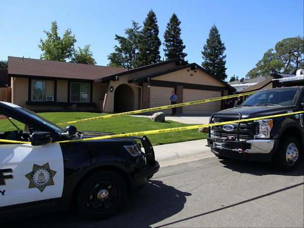 Sacramento Sheriff's vehicles outside the Citrus Heights home of a suspect arrested in connection with the Golden State Killer case.