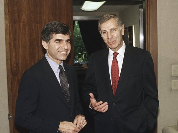In this May 20, 1987 file photo Democratic presidential, Michael Dukakis, the Massachusetts governor, left, and Republican California Governor George Deukmejian, chat at the Capitol in Sacramento, Calif. 