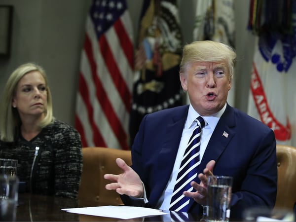 President Donald Trump with Homeland Security Secretary Kirstjen Nielsen, left, speaks during a roundtable talks on sanctuary cities with law enforcement officers in the Roosevelt Room of the White House, in Washington, Tuesday, March 20, 2018.