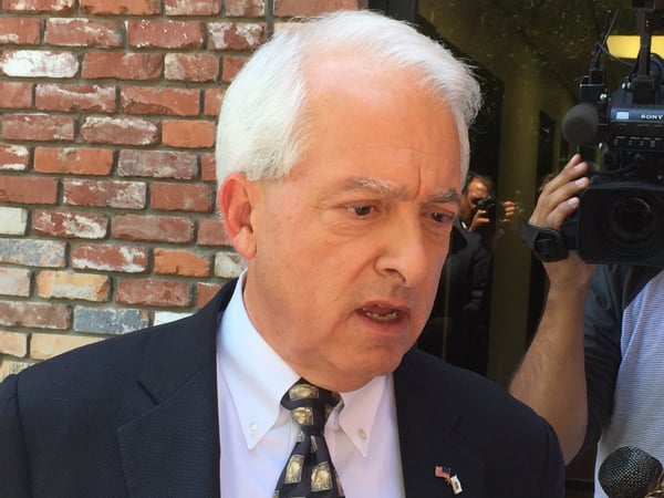 Republican gubernatorial candidate John Cox speaks with reporters after a campaign stop in Sacramento.