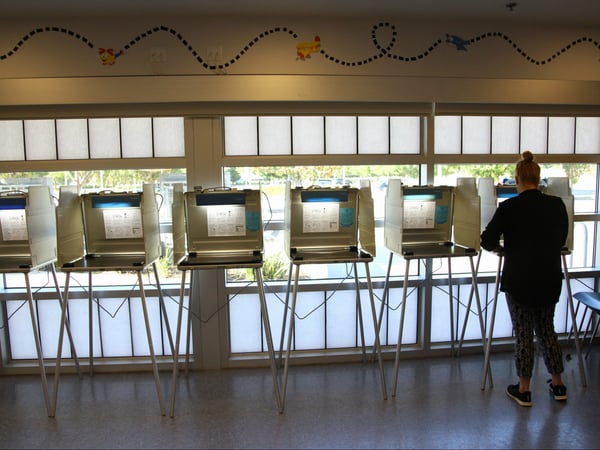 A voter fills out her California primary ballot at a North Natomas Library voting station on June 5, 2018.