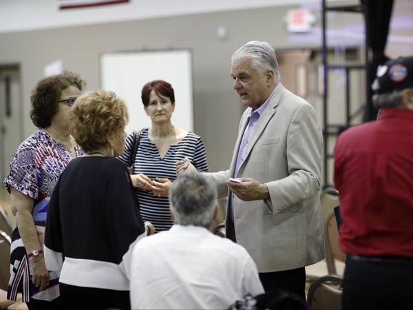 Clark County Commission member Steve Sisolak meets with people during a forum for Nevada gubernatorial candidates organized by Nevada faith groups, Tuesday, May 8, 2018, in Las Vegas. 