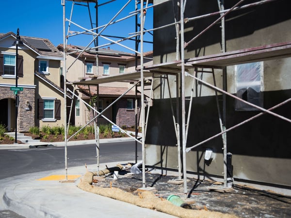 Construction scaffolding sits in a housing development in Folsom, Calif.