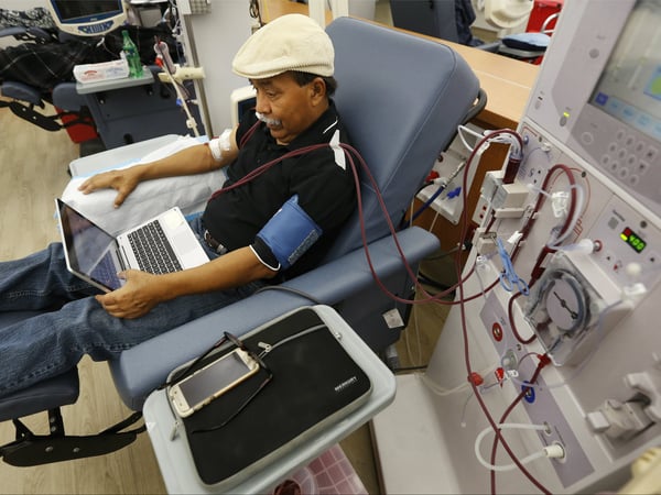 In this photo taken Monday, Sept. 24, 2018, Adrian Perez undergoes dialysis at a DaVita Kidney Care clinic in Sacramento, Calif. If approved by voters in November, Proposition 8, would limit dialysis clinics' profits.