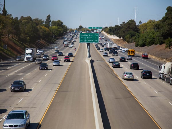 Cars drive on Highway 50 in Sacramento.