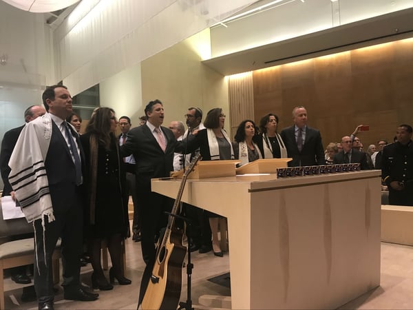 Sacramento Mayor Darrell Steinberg joins rabbis and cantors from several Sacramento-area synagogues as they lead the audience in a prayer for peace after the shooting of 11 people inside a Pittsburgh synagogue on Oct. 27.