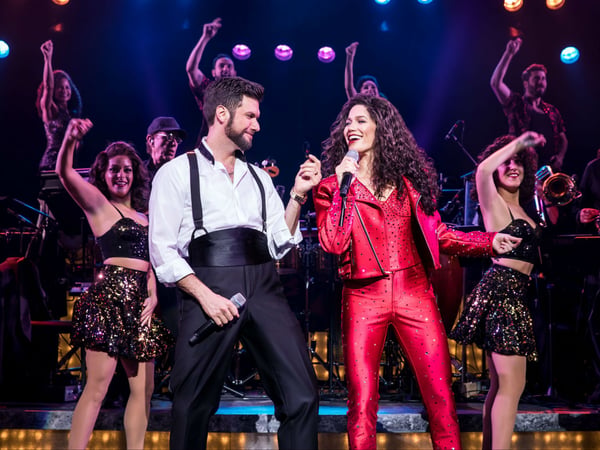 Mauricio Martinez as Emilio Estefan and Christie Prades as Gloria Estefan and the company of the Broadway On Tour presentation of ON YOUR FEET! Oct. 30 – Nov. 4, 2018 at the Sacramento Community Center Theater.