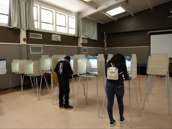 Voters cast ballots in person at the Maple Neighborhood Center in South Sacramento.