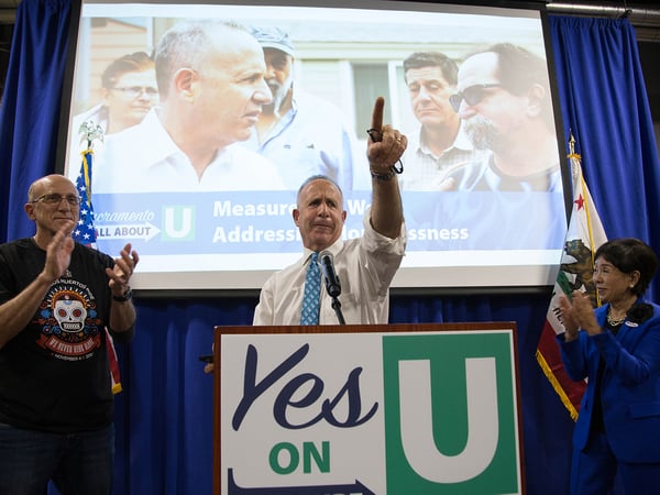 Sacramento City Councilmember Jay Schenirer (left) and Rep. Doris Matsui (right) share a stage with Mayor Darrell Steinberg at a watch party for Measure U, and Propositions 1 and 2.