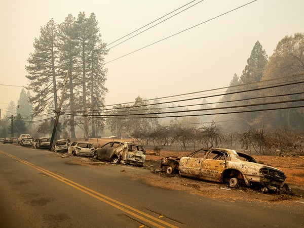 Abandoned vehicles line Skyway after a wildfire burned through Paradise, Calif., on Friday, Nov. 9, 2018.