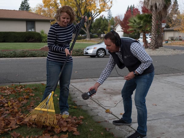 Reporter Randol White records the sound of question asker Jennifer Drayton raking leaves in her Arden Park yard.