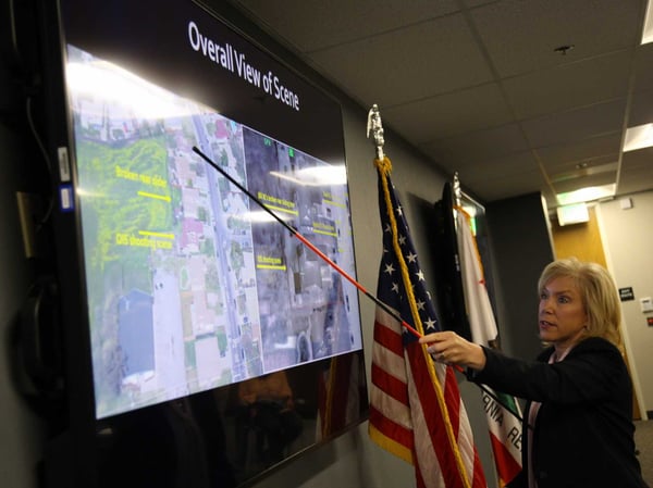 Sacramento County District Attorney Anne-Marie Schubert points to a picture of the scene during her press conference announcing her office's findings in the case of the fatal police shooting of Stephon Clark.