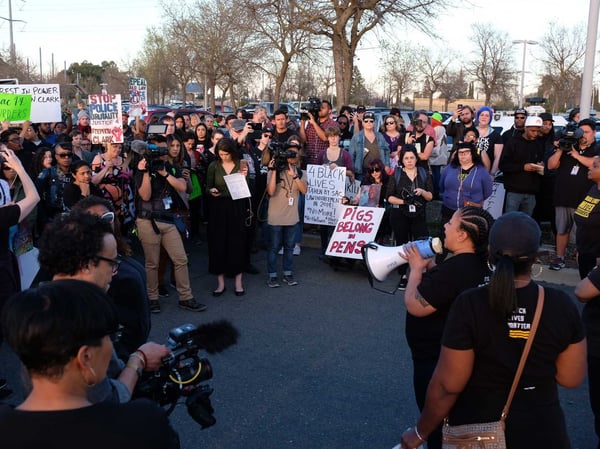 Demonstrators gather at the Meadowview light-rail station for a vigil and march on the anniversary of Stephon Clark's death.