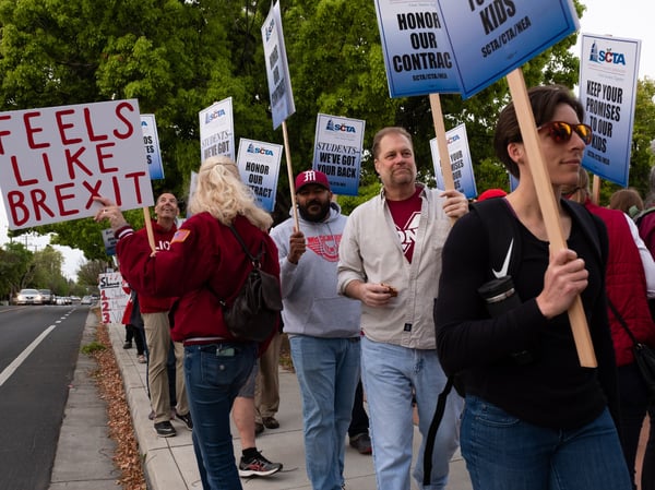 Teachers strike outside McClatchy High School on April 11, 2019.