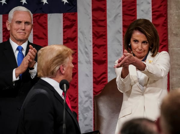 President Donald Trump turns to House speaker Nancy Pelosi of Calif., as he delivers his State of the Union address to a joint session of Congress on Capitol Hill in Washington, as Vice President Mike Pence watches, Tuesday, Feb. 5, 2019.