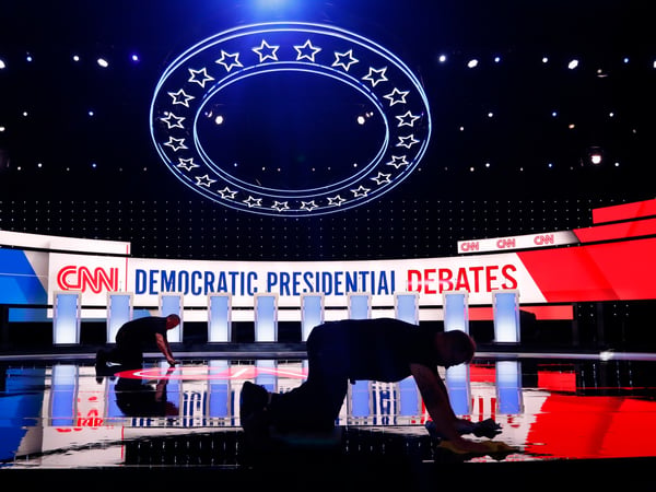 Workers get the stage ready for the Democratic presidential primary debate, Tuesday, July 30, 2019, at the Fox Theatre in Detroit.