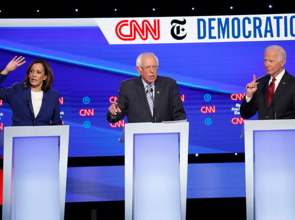 Democratic presidential candidate Sen. Kamala Harris, D-Calif., Sen. Bernie Sanders, I-Vt., center, and former Vice President Joe Biden all speak at the same time during a Democratic presidential primary debate on Oct. 15, 2019, in Westerville, Ohio.