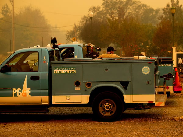 Pacific Gas & Electric trucks stage as a wildfire called the Kincade Fire burns in Healdsburg, Calif., Sunday, Oct. 27, 2019.