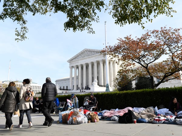 People wait in line outside the Supreme Court in Washington, Monday, Nov. 11, 2019, to be able to attend oral arguments in the case of President Trump's decision to end the Obama-era, Deferred Action for Childhood Arrivals program (DACA).