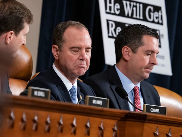 House Intelligence Committee Chairman Adam Schiff, left, responds to Rep. Devin Nunes, the ranking member, right, as the panel holds the first public impeachment hearings of President Trump in Washington on Nov. 13, 2019.