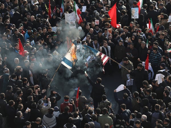 Mourners burn mock flags of the U.S. and Israel during a funeral ceremony for Iranian Gen. Qassem Soleimani and his comrades, who were killed in Iraq in a U.S. drone strike on Friday, in Tehran, Iran on Jan. 6, 2020.
