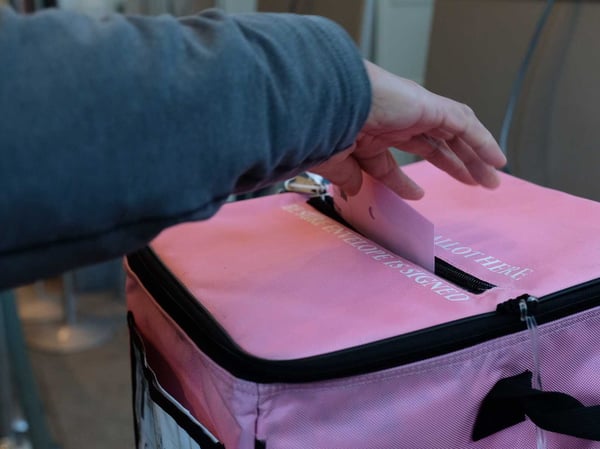 A Sacramento County voter drops their ballot off at a vote center March 3, 2020