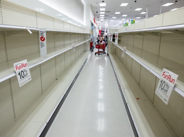 The shelves of a Target in Arden-Arcade sit cleared out of toilet paper on Friday, March 13, 2020.