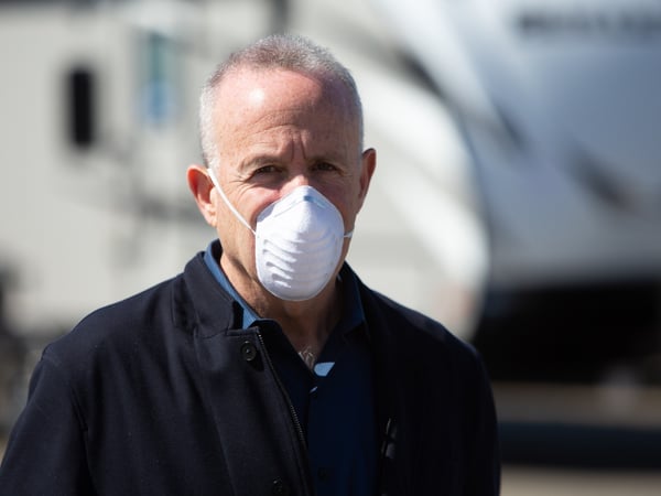 Mayor Darrell Steinberg demonstrates how to wear a protective mask to prevent spreading coronavirus to others if the wearer may unknowingly be infected and asymptomatic, Friday, April 3, 2020.