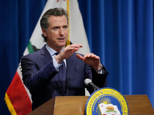 California Gov. Gavin Newsom discusses his revised 2020-2021 state budget during a news conference in Sacramento, Calif., Thursday, May 14, 2020.