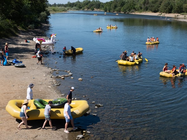 Rental and personal rafts enter the water at the Sunrise Recreation Area Sunday, May 24, 2020.