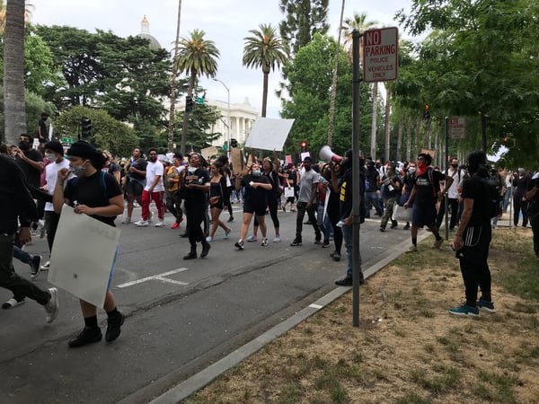 Protesters march through downtown Sacramento on Sunday evening.