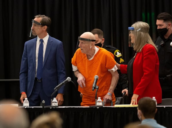 Joseph James DeAngelo, center, charged with being the Golden State Killer, his helped up by his attorney, Diane Howard, as Sacramento Superior Court Judge Michael Bowman enters the courtroom in Sacramento. Monday June 29, 2020.