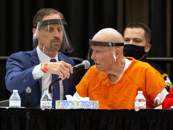 Joseph Cress, left, the public defender for Joseph James DeAngelo, charged with being the Golden State Killer, adjusts the microphone for his client during a hearing in Sacramento Superior Court in Sacramento. Monday June 29, 2020